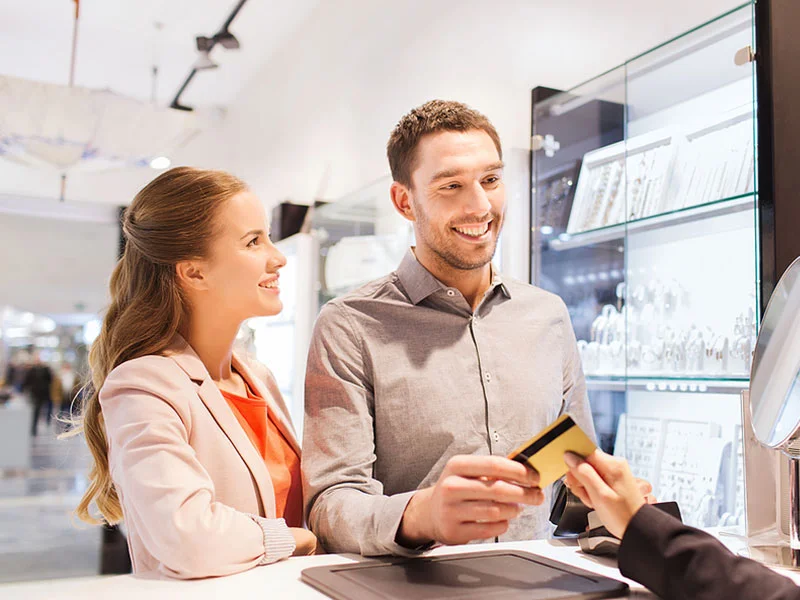 couple paying for jewelry at a jewelry store