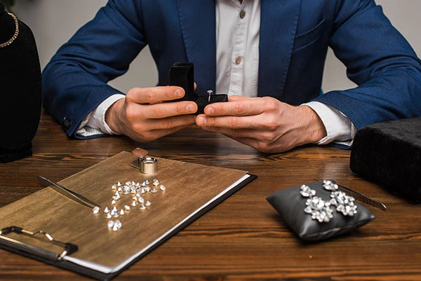 jewelry appraiser examining a diamond ring