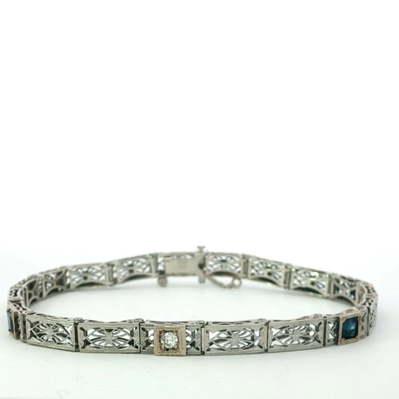 14K white gold and platinum filigree bracelet with diamond and sapphires